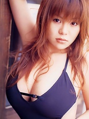 Voluptuous asian hottie at the beach in her skimpy little bikinis