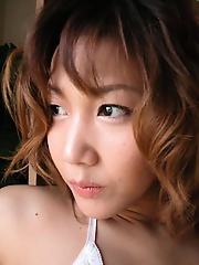 A busty Japanese beauty posing nude here