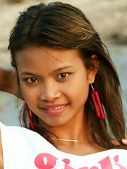 Tiny teen Thai girl takes a swim in the Gulf of Thailand